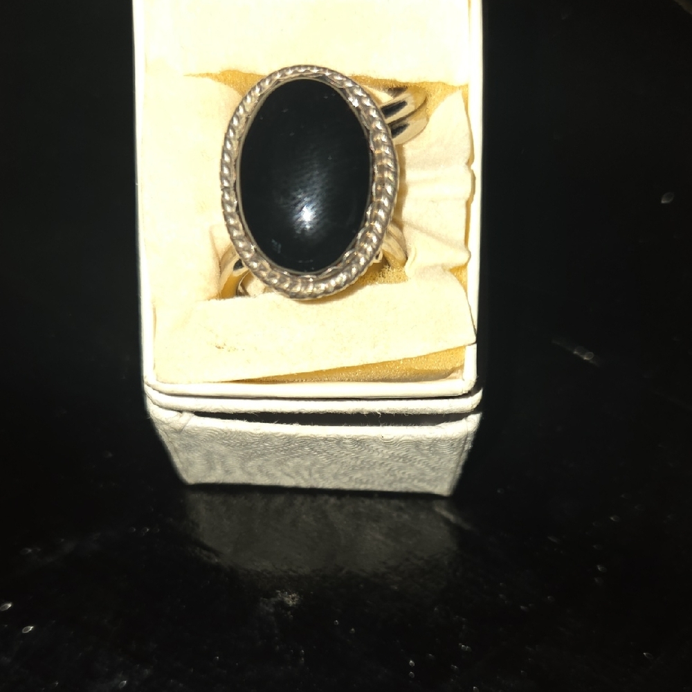 Elegant Black Oval Ring with Silver Detailing